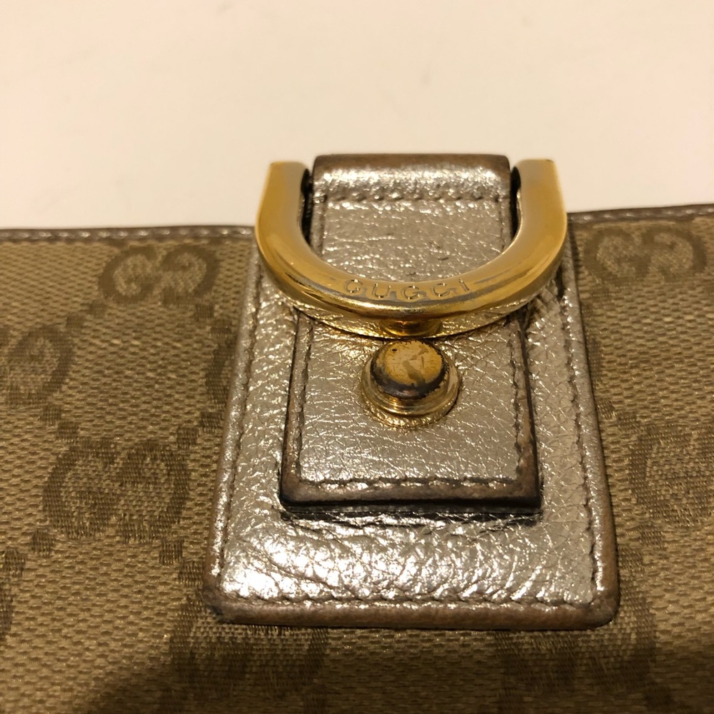 Gucci wallet in metallic leather and GGfabric